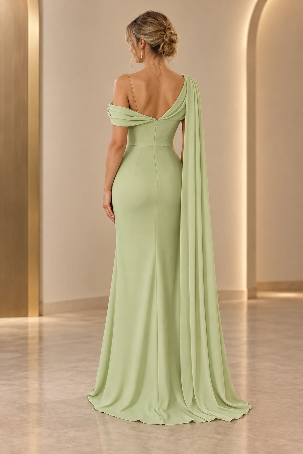 Graceprom floor-length wedding guest gown with draped back neckline, fitted waist, and elegant flowing shoulder cape, back view