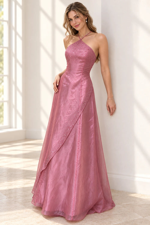 Elegant dusty rose chiffon prom dress with crisscross halter neckline, sparkling beaded bodice, asymmetrical draped overlay and flowing A-line skirt