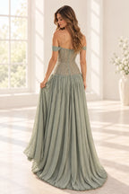 Sage green chiffon A-line prom dress back view featuring off-the-shoulder sleeves, intricate beaded corset embroidery, center zipper and flowing floor-length skirt