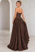 Chocolate brown chiffon A-line prom dress back view featuring a strapless embroidered corset, delicate beading, center zipper and flowing floor-length pleated skirt
