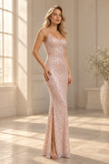 Elegant sequin prom dress with a scoop neckline, spaghetti straps, fitted silhouette, and thigh-high slit.
