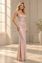 Elegant sequin prom dress with a scoop neckline, spaghetti straps, fitted silhouette, and thigh-high slit.