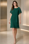Vedress emerald green mother of the bride dress with bateau neckline flutter sleeves layered A-line silhouette and knee-length skirt front view