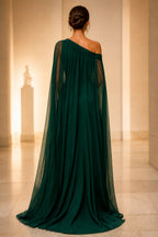 Back view of emerald green one shoulder cape floor length wedding guest dress by GraceProm