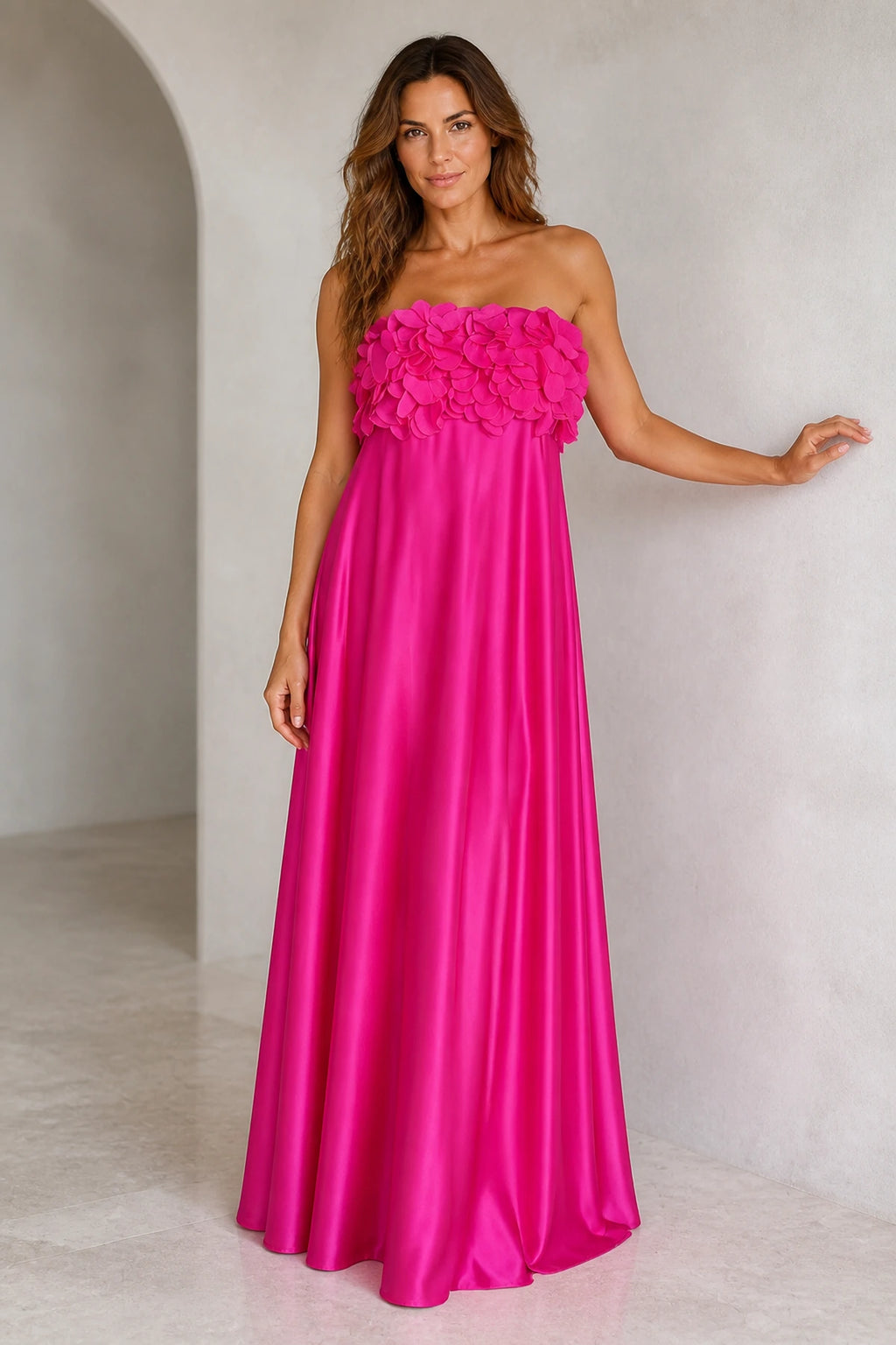 Fuchsia strapless A-line wedding guest dress with 3D floral appliqué bodice and shiny floor-length skirt