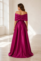 Fuchsia off shoulder wedding guest dress with bow back detail and center zipper