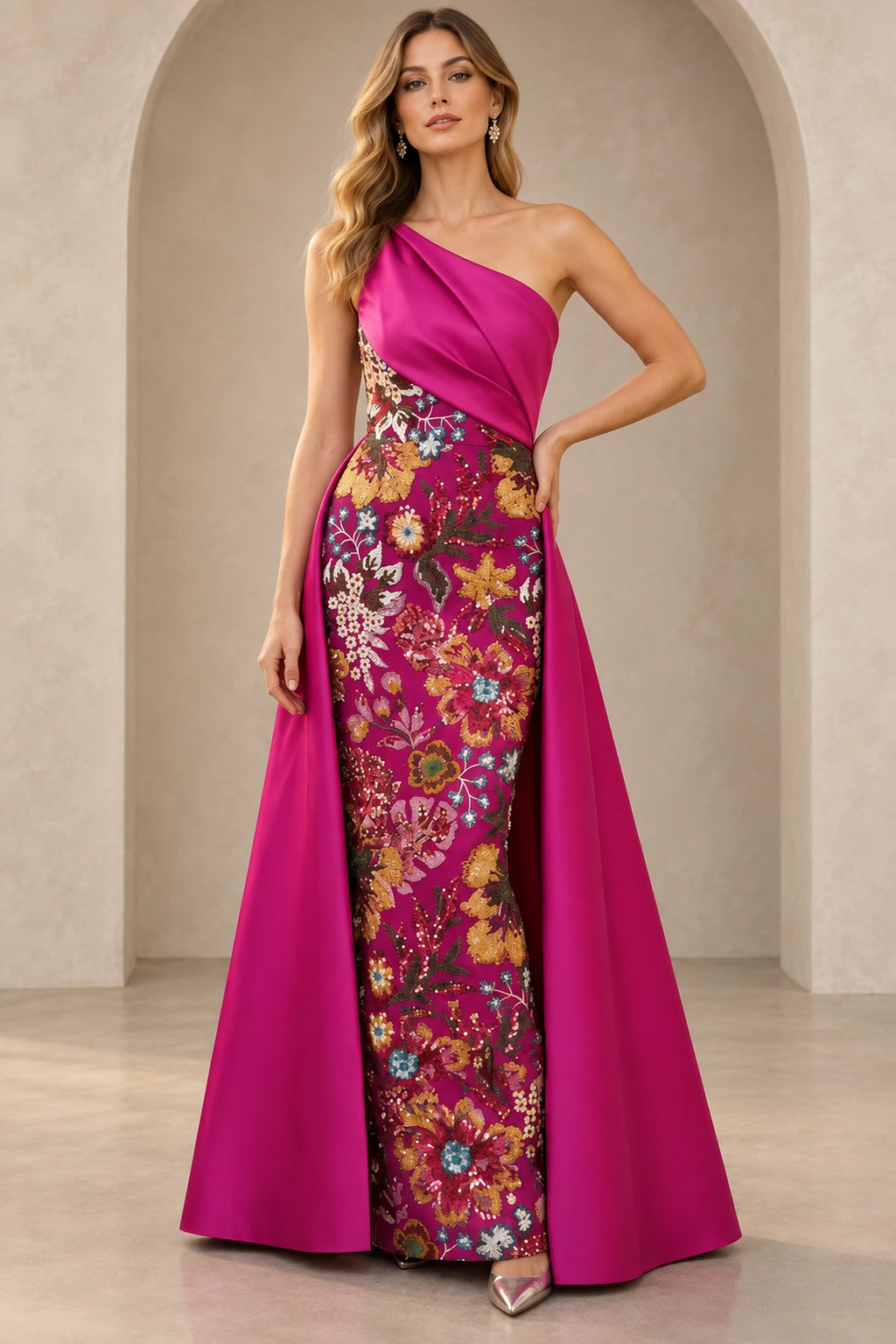Fuchsia Mother of the Bride Dress with one-shoulder neckline, floral embroidery and dramatic floor-length overskirt