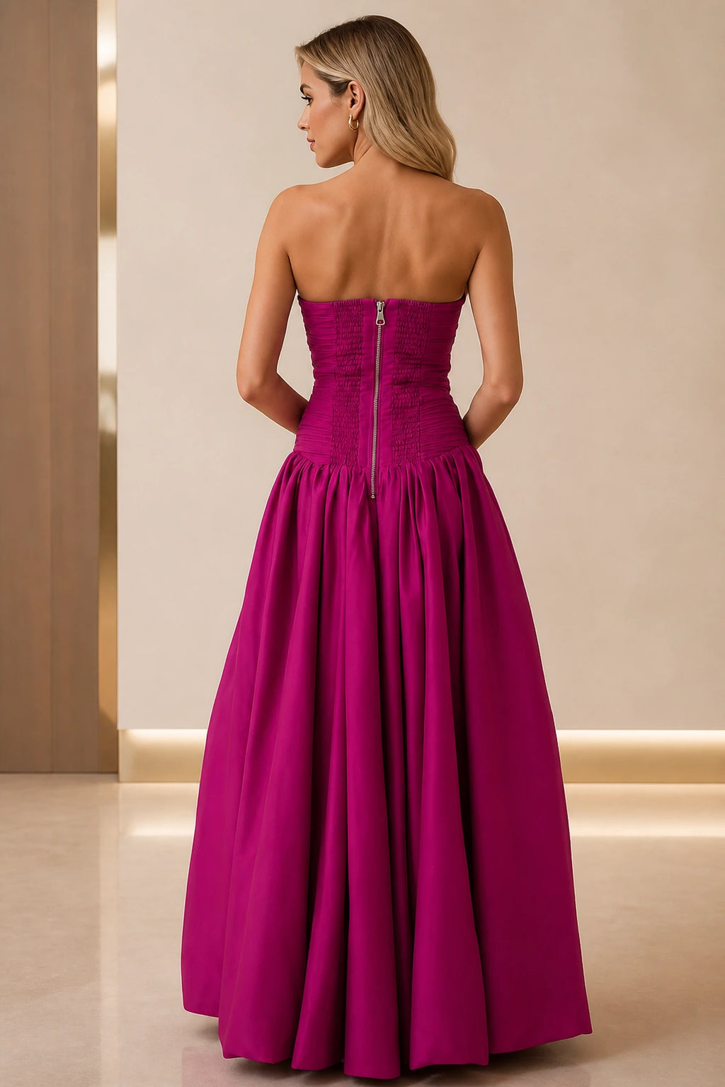 Back view of fuchsia strapless prom dress with ruched bodice and zipper