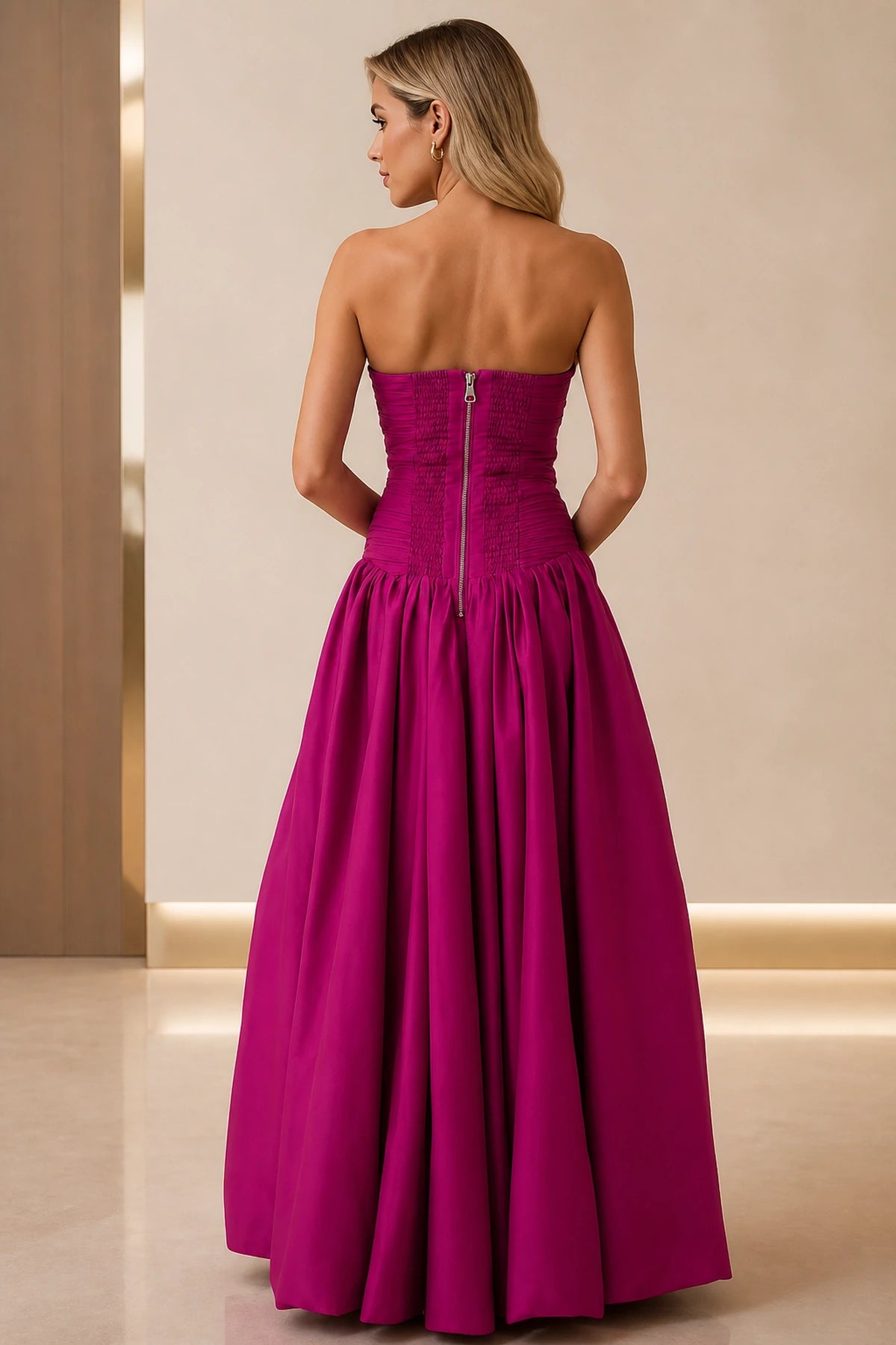 Back view of fuchsia strapless prom dress with ruched bodice and zipper