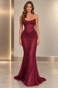 Burgundy sequin mermaid prom dress front view with sweetheart strapless neckline, structured corset bodice, ruched waist and floor-length fitted skirt