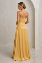 Golden yellow floor-length wedding guest dress with asymmetric open back, slim straps and center zipper back view