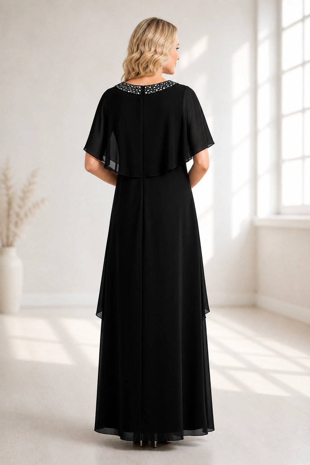 Back view of black floor-length mother of the bride dress with cape sleeves and zipper back by GraceProm