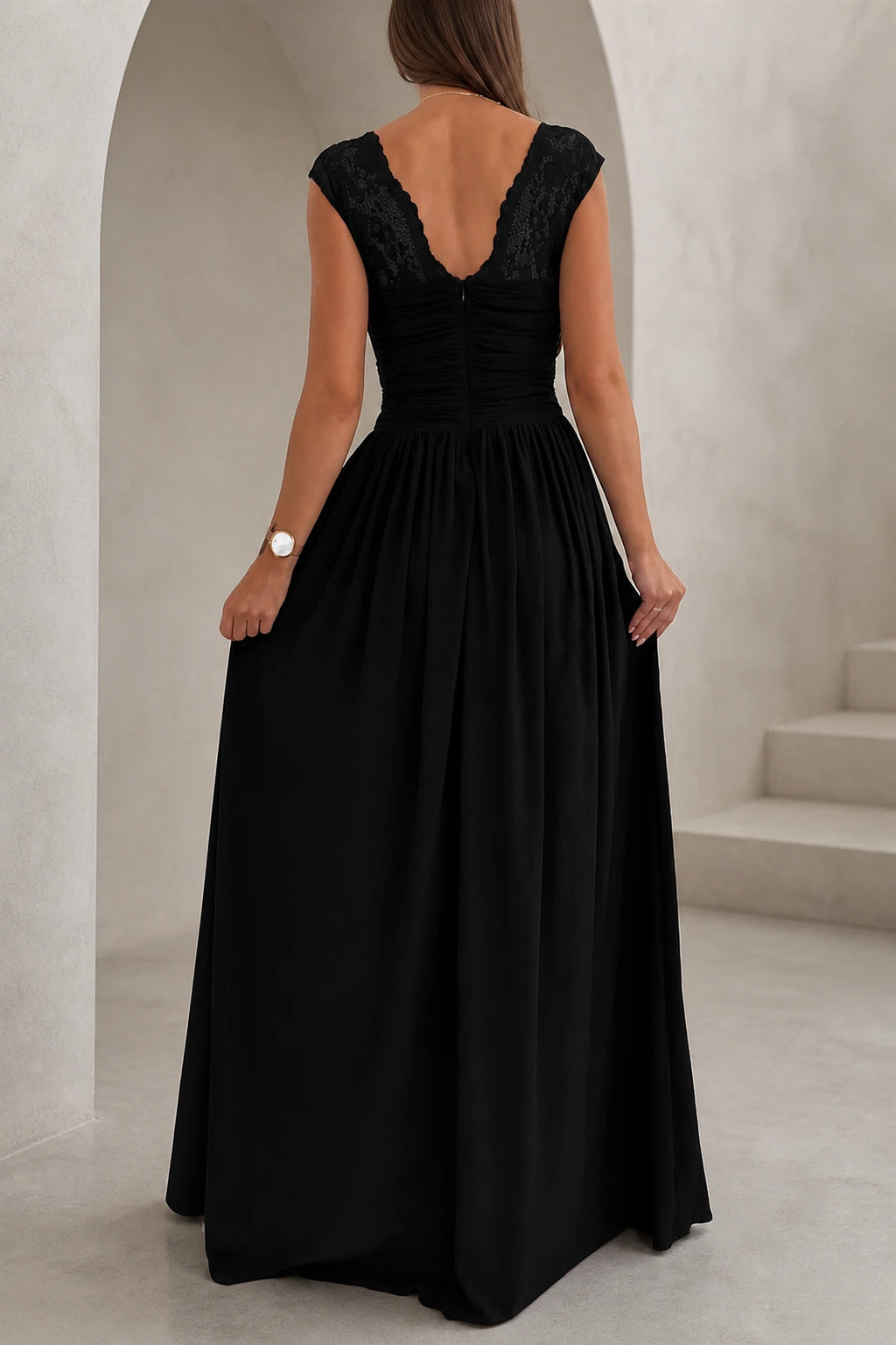 Back view of black lace V-back floor length wedding guest dress