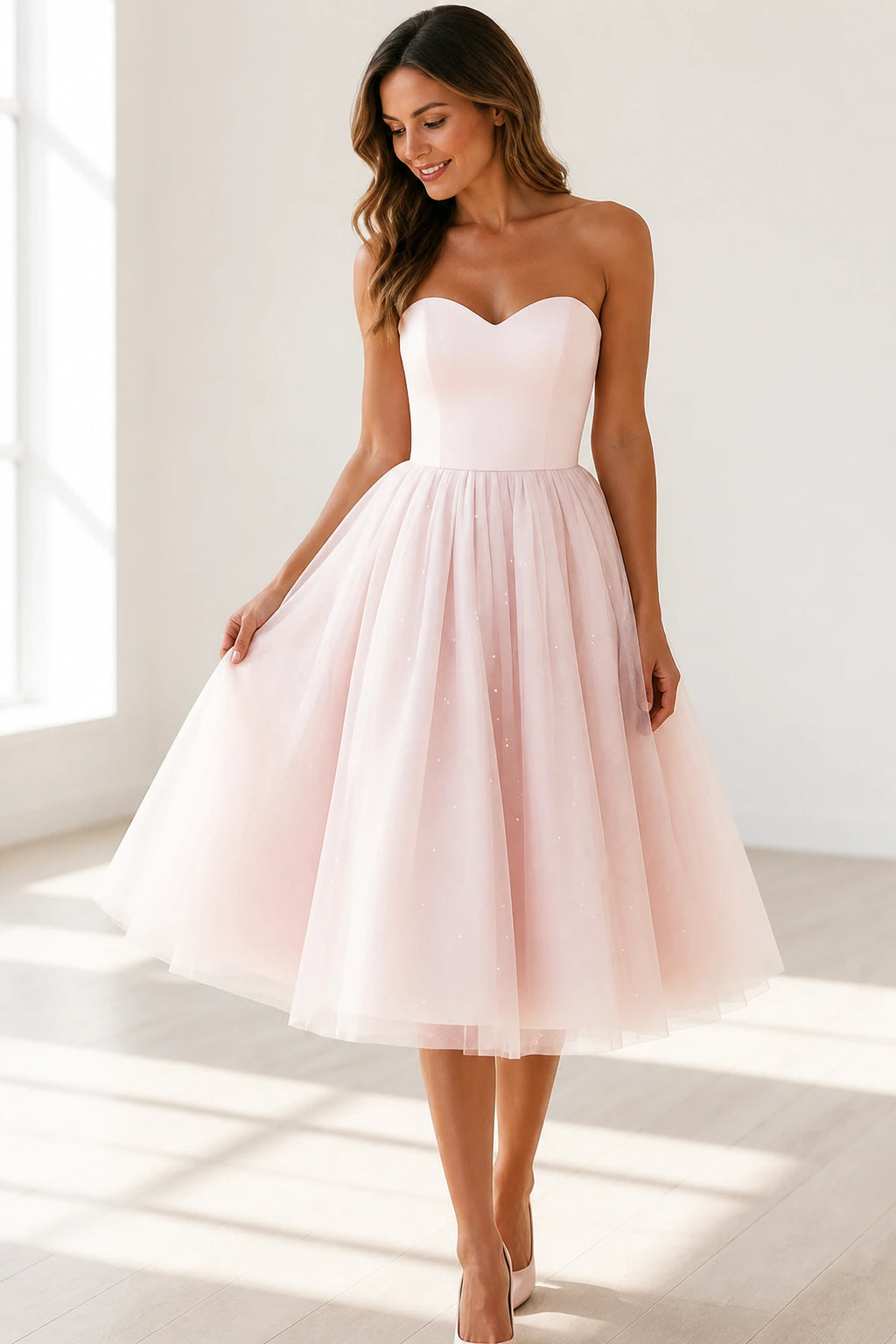 Blush pink A-line bridesmaid dress with sweetheart neckline and tea-length tulle skirt by GraceProm