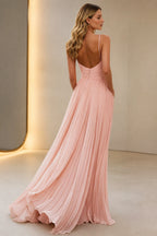 Back view of Graceprom blush pink wedding guest dress with low back covered buttons and pleated long skirt