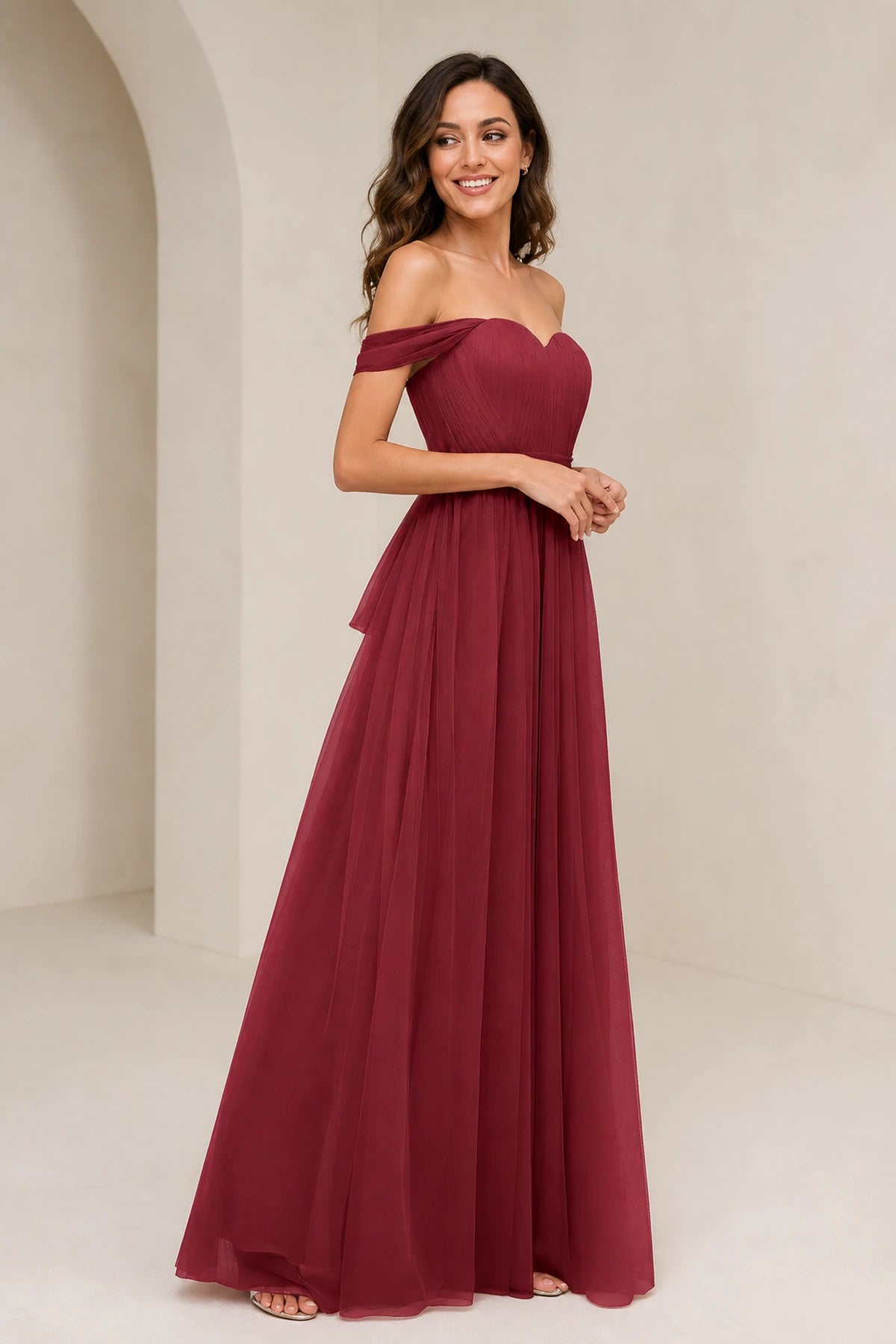 Back view of burgundy bridesmaid dress with open back and statement bow detail by GraceProm