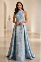graceprom dusty blue A-line wedding guest dress front view, halter crisscross neck, metallic gold floral brocade, full floor-length skirt
