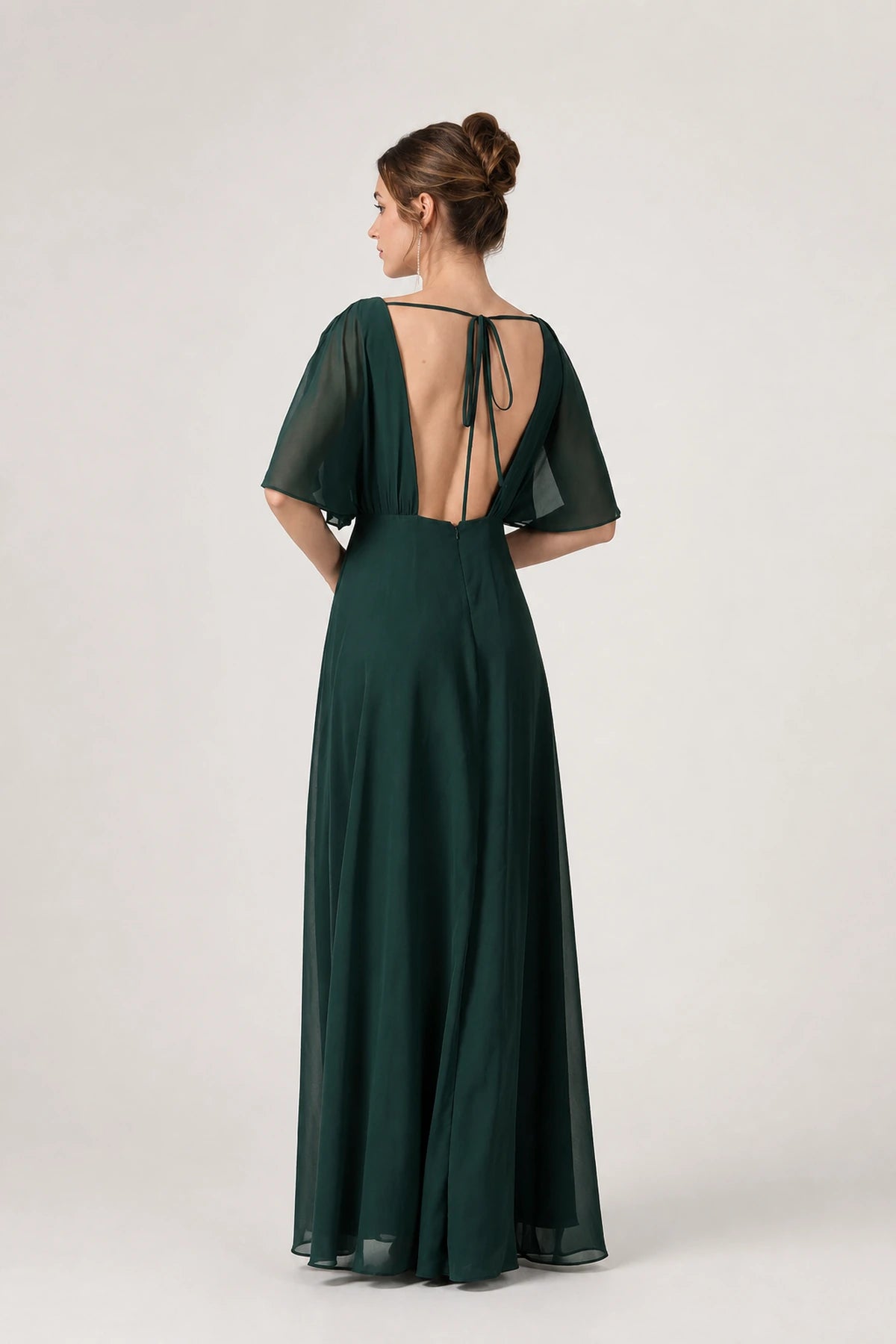 Back view of emerald green bridesmaid dress with flutter sleeves, open back and tie detail by GraceProm