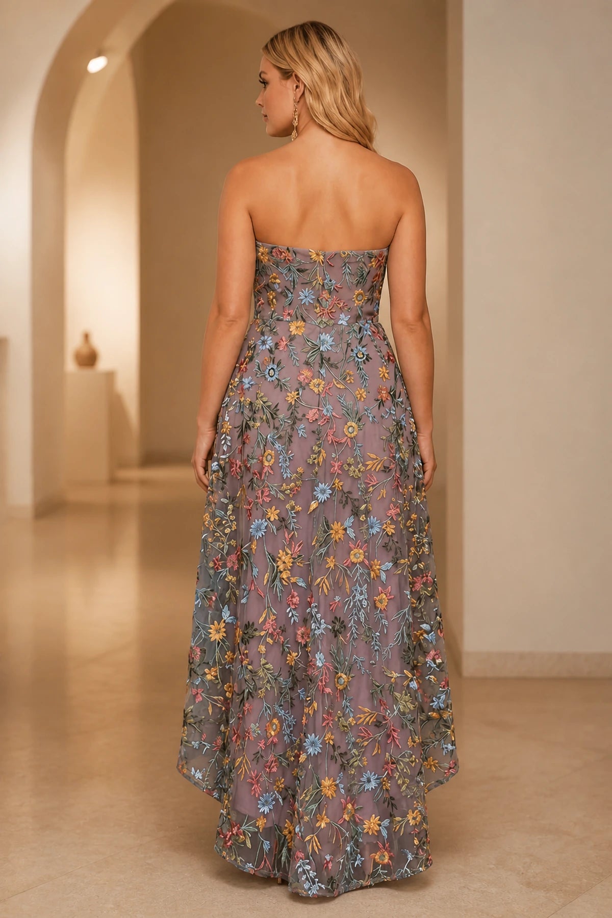 Back view of floral strapless high-low wedding guest dress with zipper by Graceprom