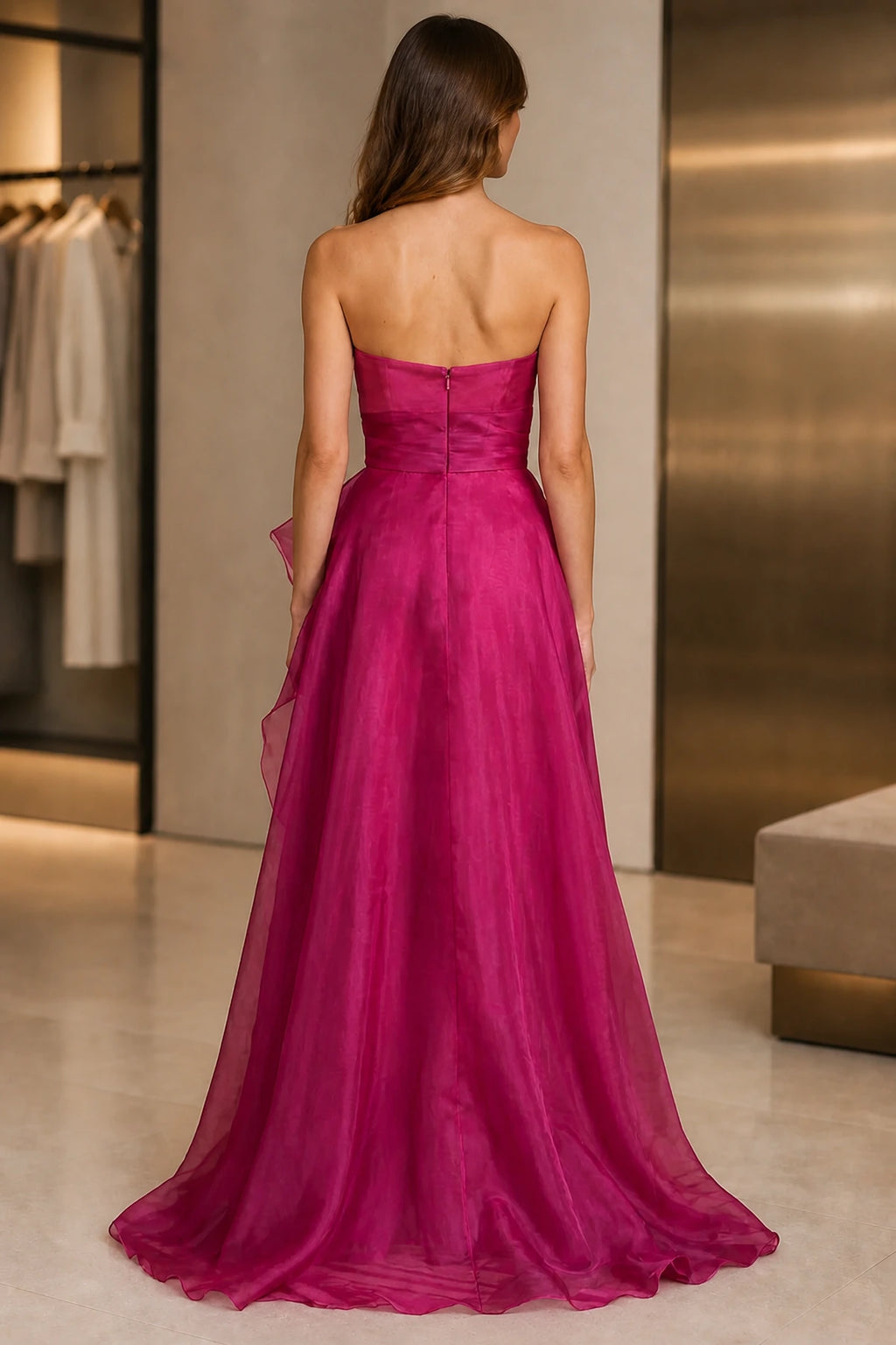 Back view of fuchsia strapless floor length A-line prom dress with zipper