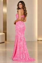 Back view of Graceprom hot pink one shoulder sequin mermaid prom dress with open back cutout and sweep train
