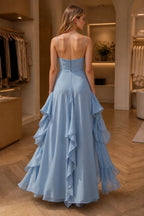 Back view of Graceprom light blue A-line prom dress with spaghetti straps zip back and cascading ruffle skirt