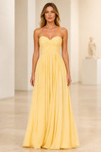 Light yellow A-line bridesmaid dress with sweetheart neckline and ruched strapless bodice by GraceProm