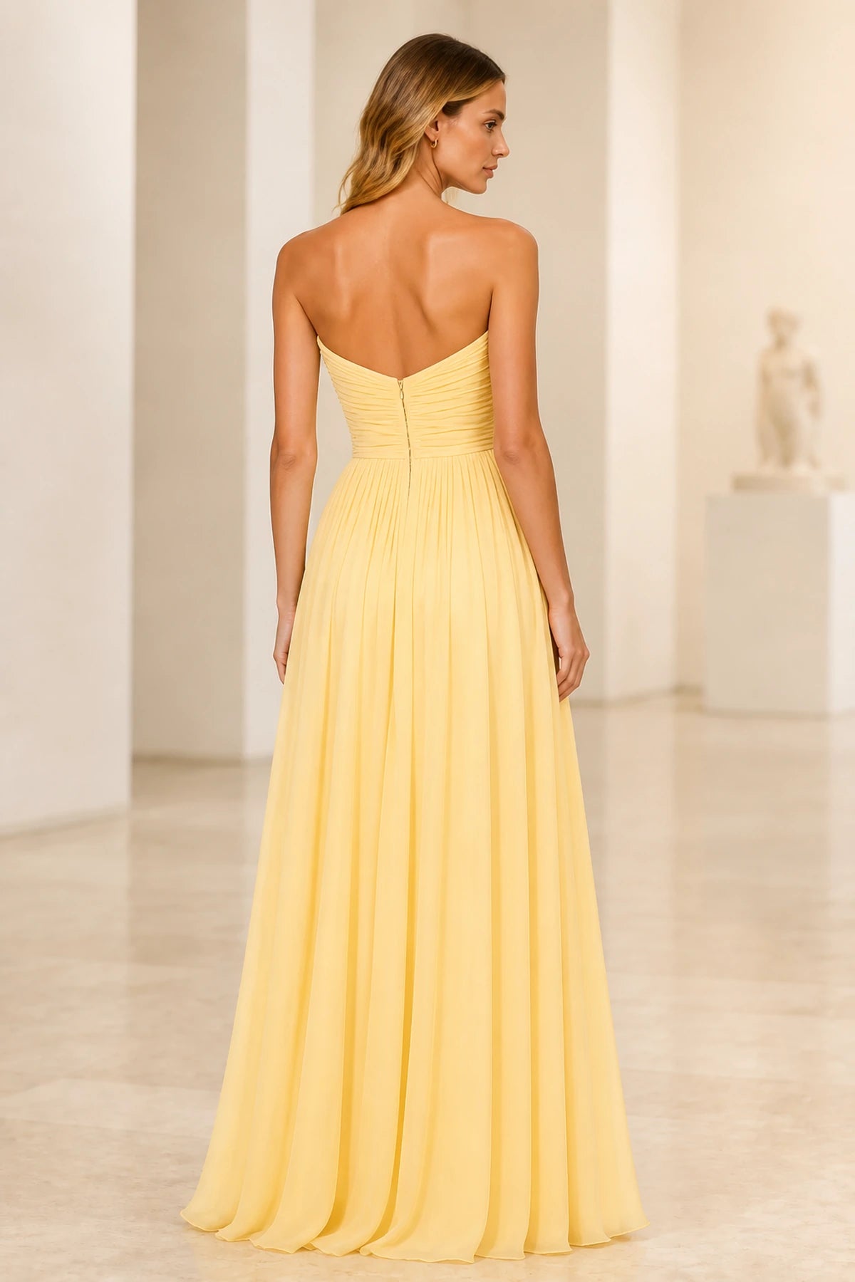 Back view of light yellow floor-length bridesmaid dress with ruched bodice and zipper back by GraceProm