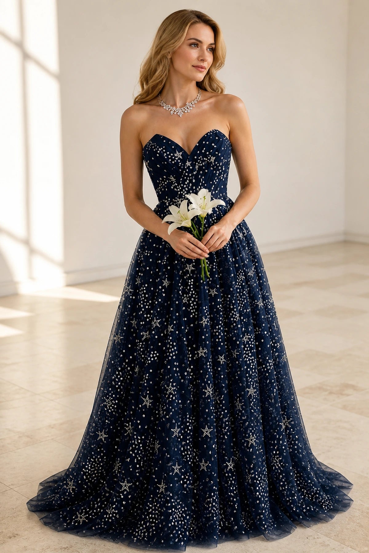 Navy strapless sweetheart A-line prom dress with sparkling star embellishments