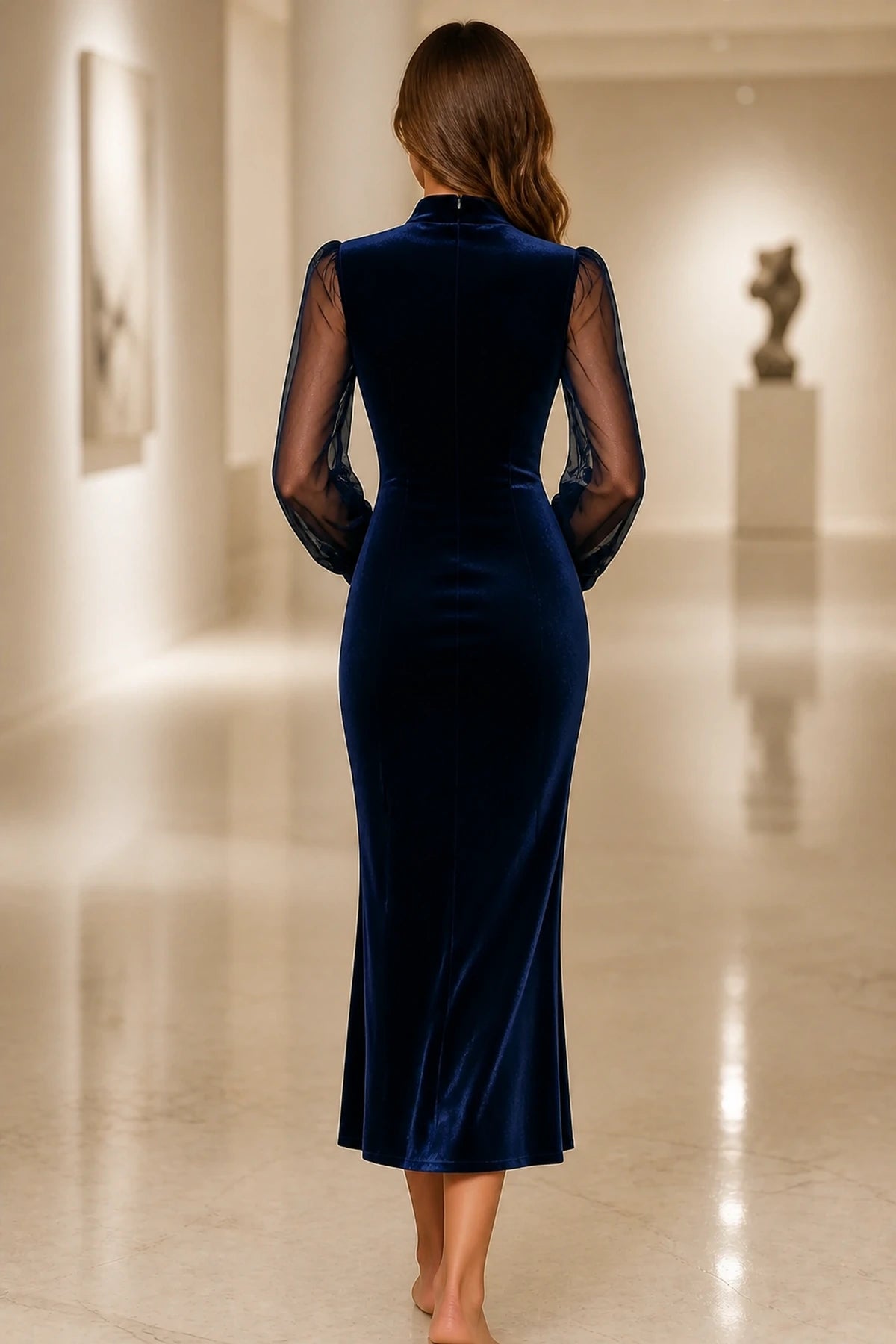 Back view of navy velvet long sleeve mother of the bride dress