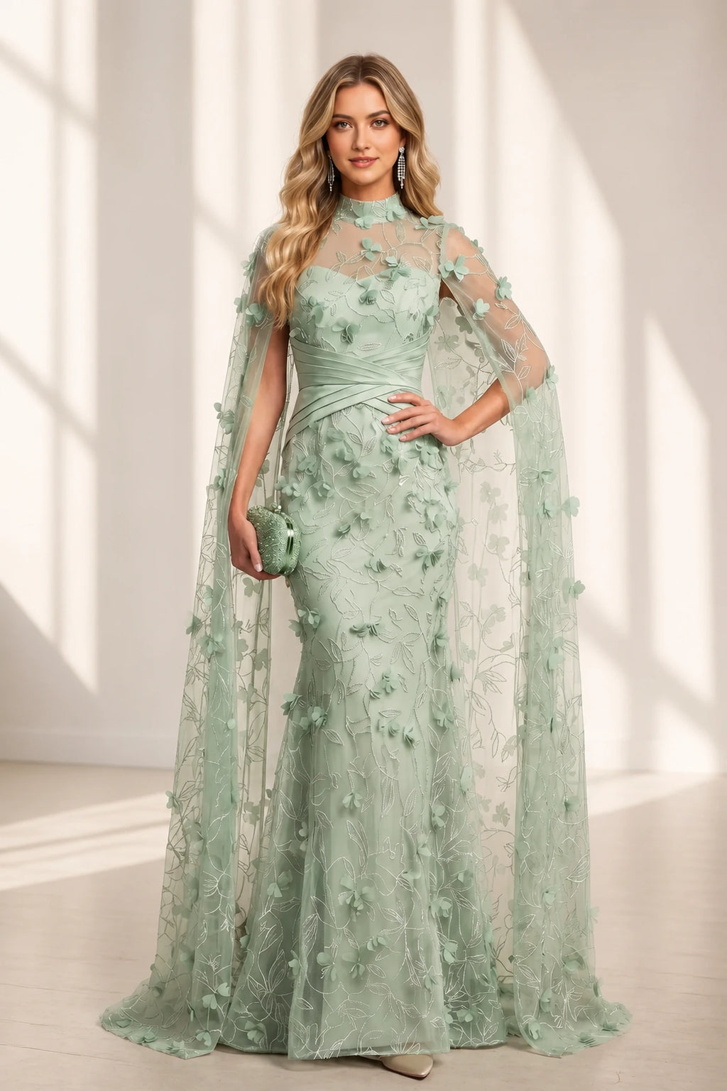 graceprom sage green mermaid wedding guest dress front view, high neck sheer mesh, flowing cape sleeves, 3D floral appliques and leaf embroidery