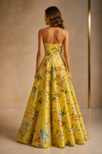 graceprom yellow floral a-line prom dress back view, strapless open back, center zipper, vibrant botanical print formal gown