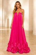 Hot pink strapless evening dress with plunging neckline, flowing A-line silhouette and oversized floral hem detail