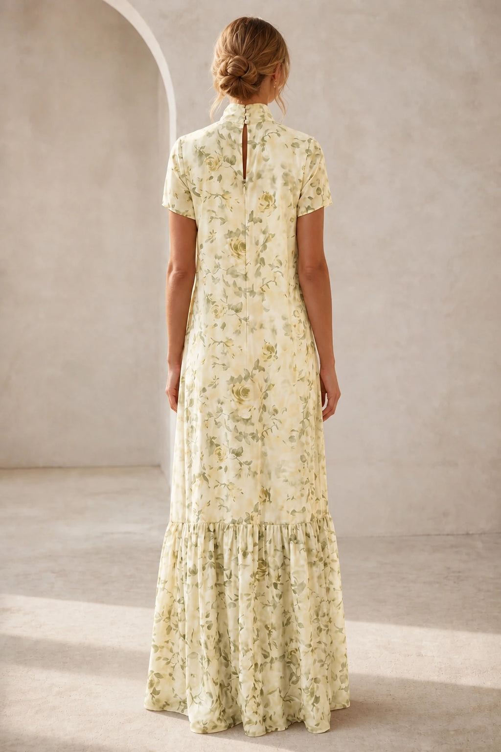 Back view of ivory floral mother of the bride dress with high neckline, keyhole back, short sleeves and floor-length A-line skirt