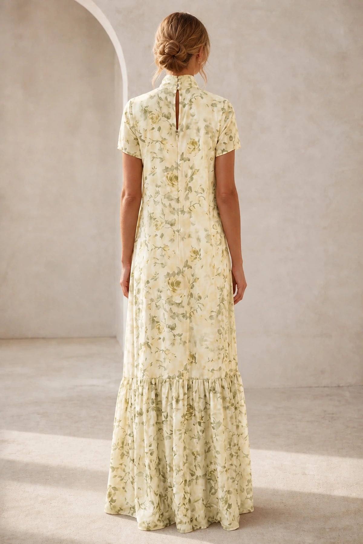 Back view of ivory floral mother of the bride dress with high neckline, keyhole back, short sleeves and floor-length A-line skirt
