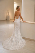 Ivory lace wedding dress with open back and corset lace up detail by GraceProm