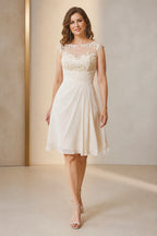Vedress ivory A-line mother of the bride dress with illusion bateau neckline cap sleeves lace appliqué ruched waist and knee-length skirt front view