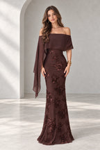 Graceprom brown lace and chiffon mermaid prom dress with floral beadwork, an off shoulder neckline and a long asymmetric cape panel.