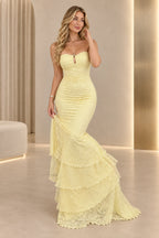 Light yellow floral lace mermaid prom dress with a strapless sweetheart neckline, keyhole detail, ruched fitted bodice, and tiered floor-length skirt.