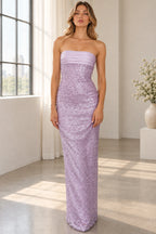 Lavender beaded strapless prom dress with fitted column silhouette and sparkling floor length skirt