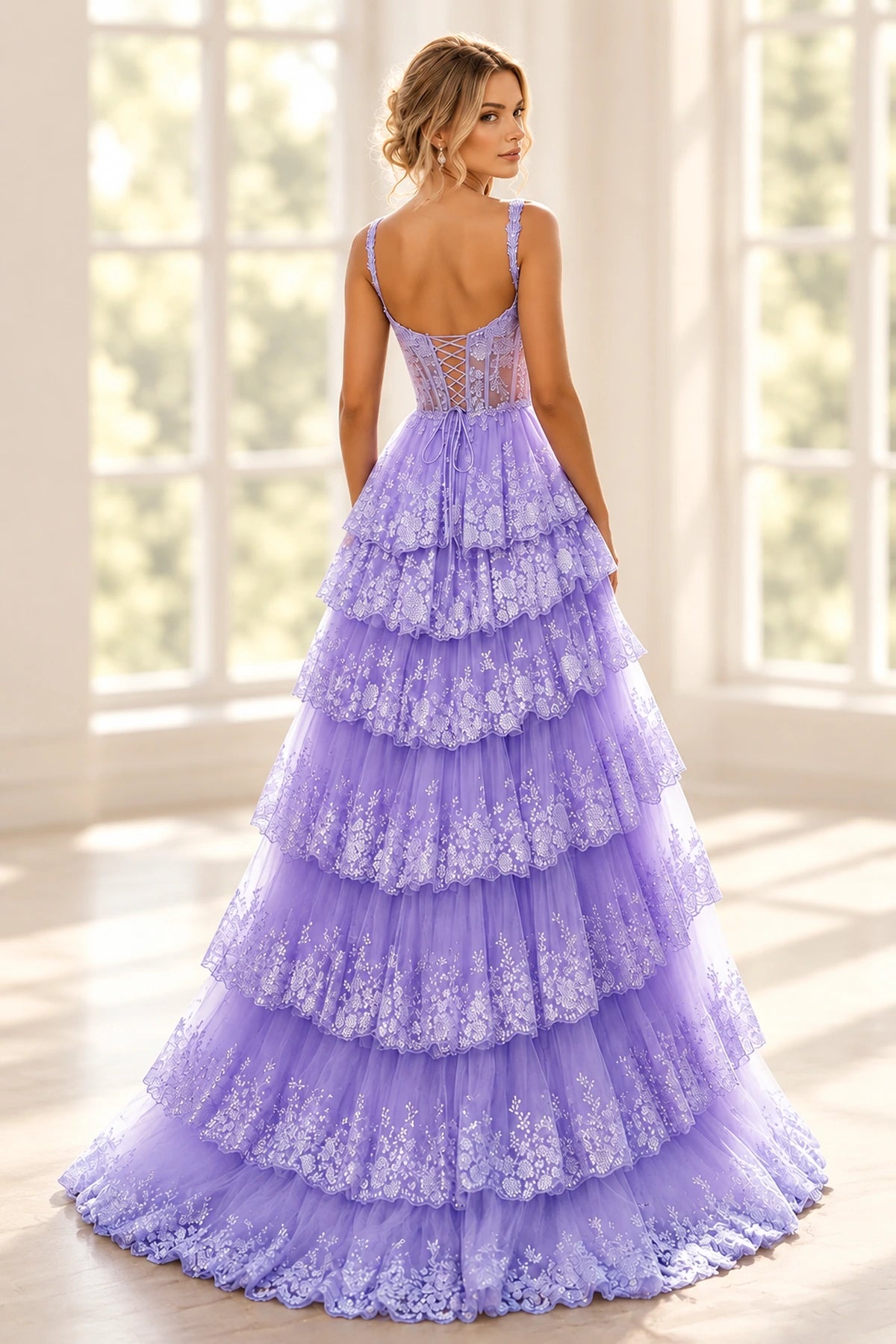 Back view of lavender lace prom dress featuring a crisscross lace-up corset, floral straps, sheer embroidered bodice, and cascading floor-length tiered tulle skirt.