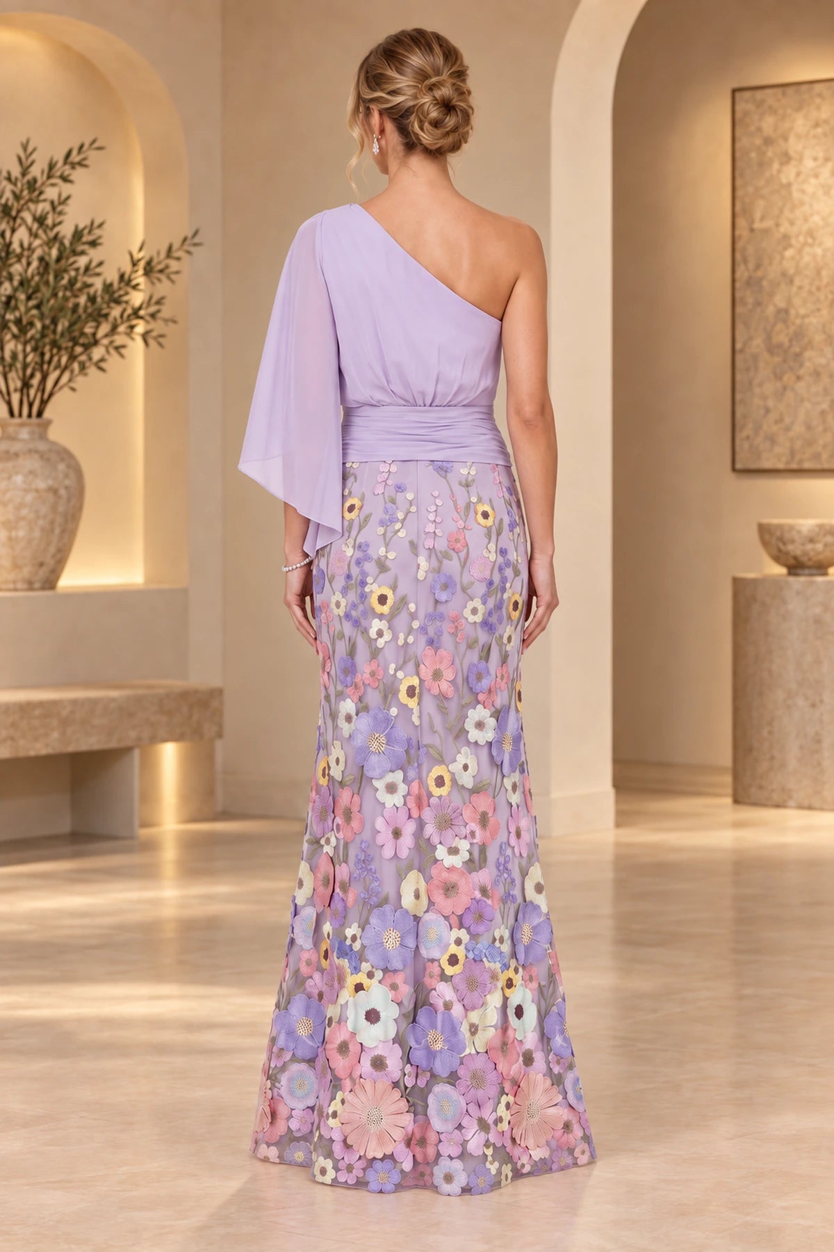 Back view of lavender mother of the bride dress with one-shoulder cape sleeve ruched waist floral embroidery and floor-length skirt