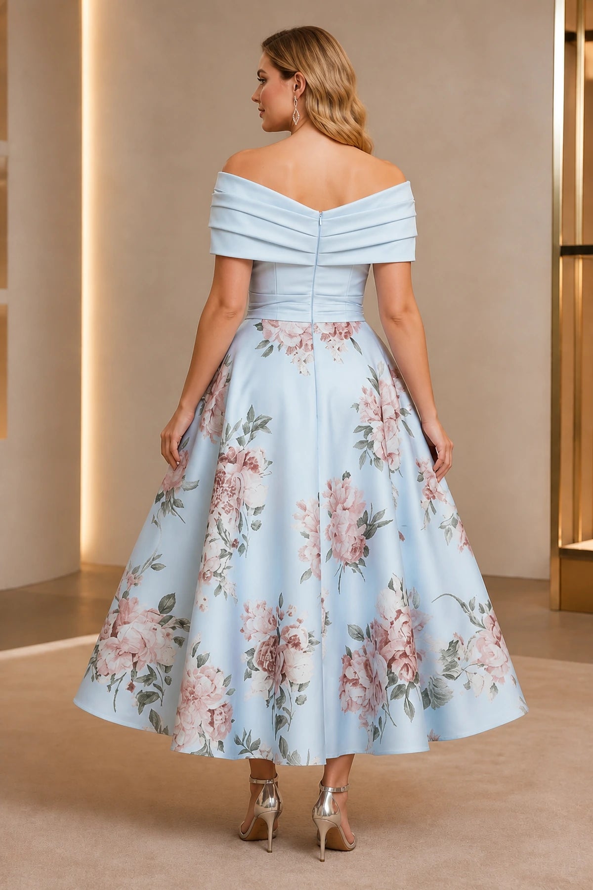 Back view of light blue floral off-shoulder tea-length dress with center zipper
