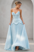 Light blue strapless sweetheart A-line bridesmaid dress with 3D floral accents and pleated floor-length skirt