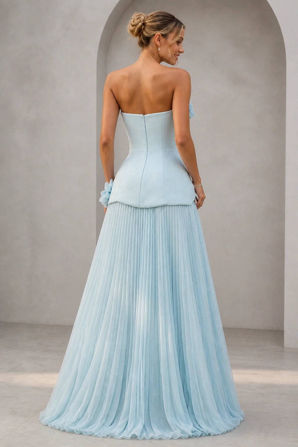 Light blue strapless sweetheart A-line bridesmaid dress with 3D floral accents and pleated floor-length skirt
