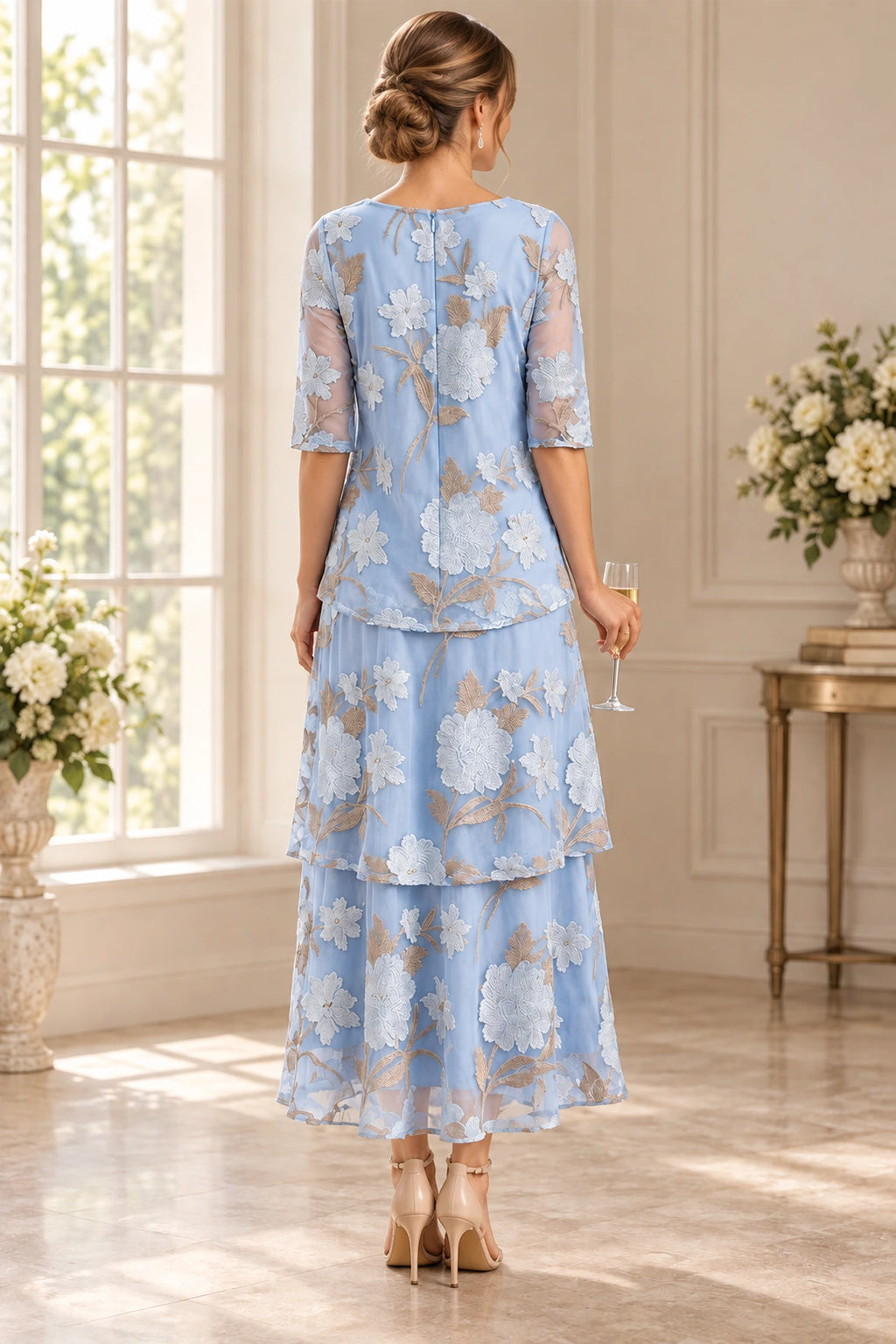 Back view of light blue Mother of the Bride Dress with floral embroidery, sheer sleeves and layered tiered skirt