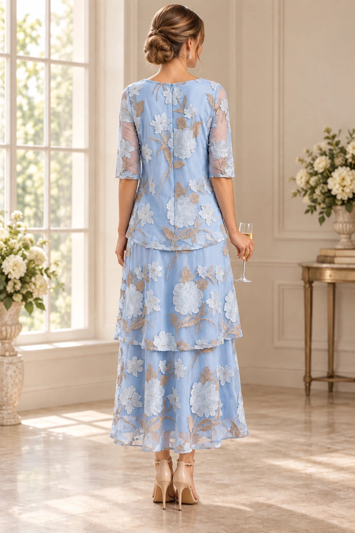 Back view of light blue Mother of the Bride Dress with floral embroidery, sheer sleeves and layered tiered skirt
