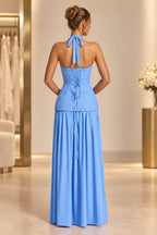 Light blue lace up back halter prom dress with flowing floor length skirt