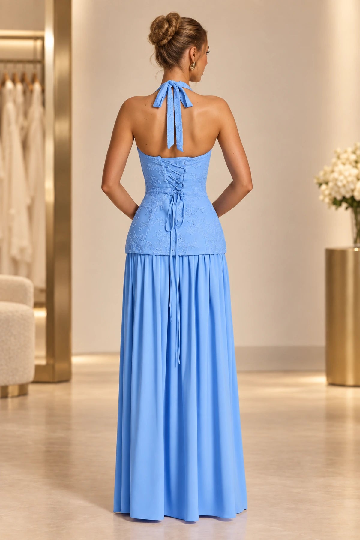 Light blue lace up back halter prom dress with flowing floor length skirt