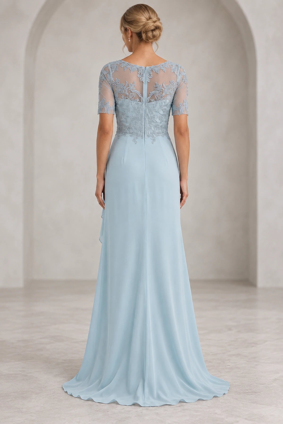 Back view of light blue Mother of the Bride Dress with sheer lace back, center zipper and flowing sweep train
